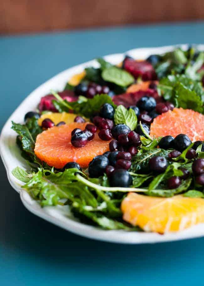 Baby Kale Salad with Oranges, Blueberries and Pomegranate | HelloGlow.co