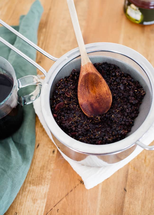 Strained Homemade Elderberry Syrup | HelloGlow.co