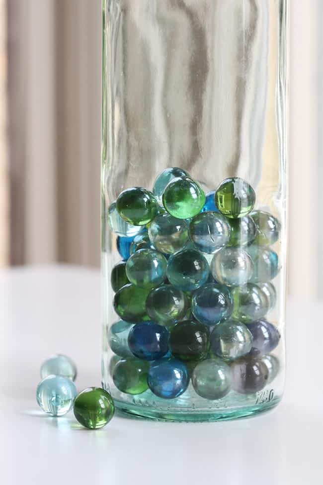 putting marbles in wine bottle candles