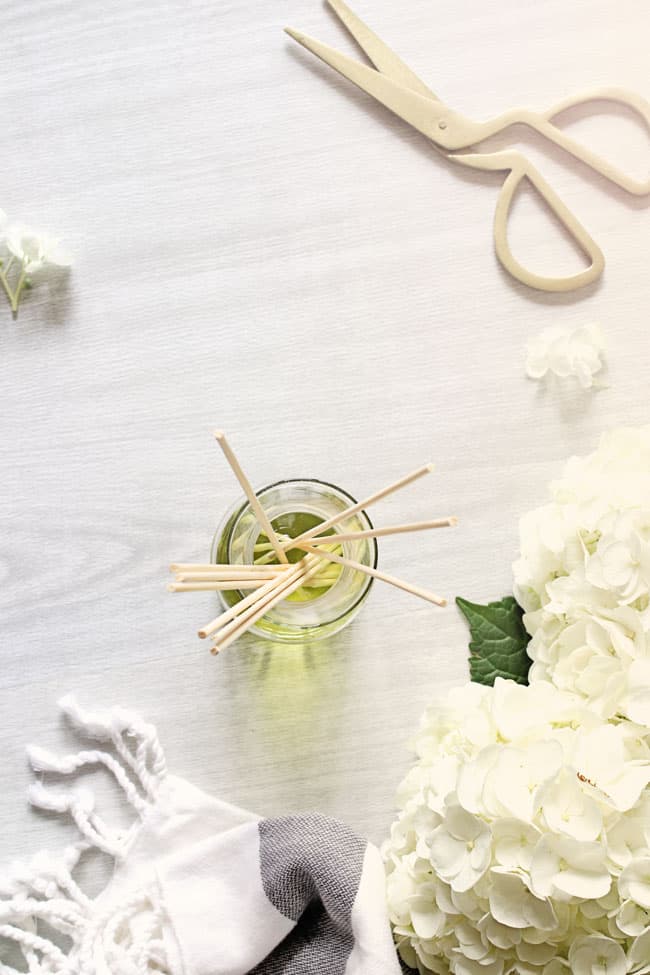 Add reed sticks to homemade reed diffuser