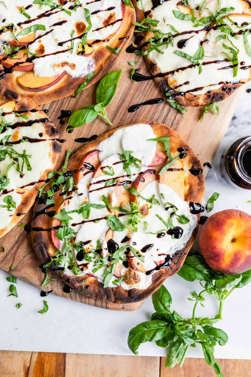 This Grilled Peach Caprese Naan Pizza Is the Ultimate Easy Summer Meal