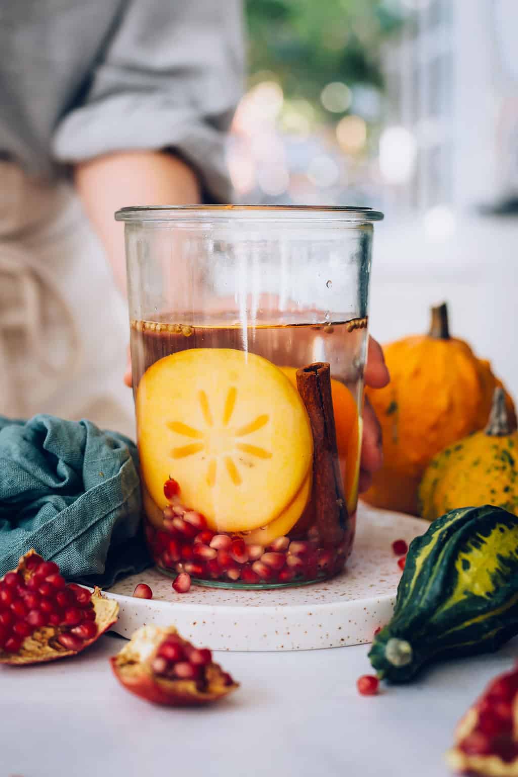 https://helloglow.co/wp-content/uploads/2019/10/Persimon-Cinnamon-Pomegranate-Infused-Water.jpg