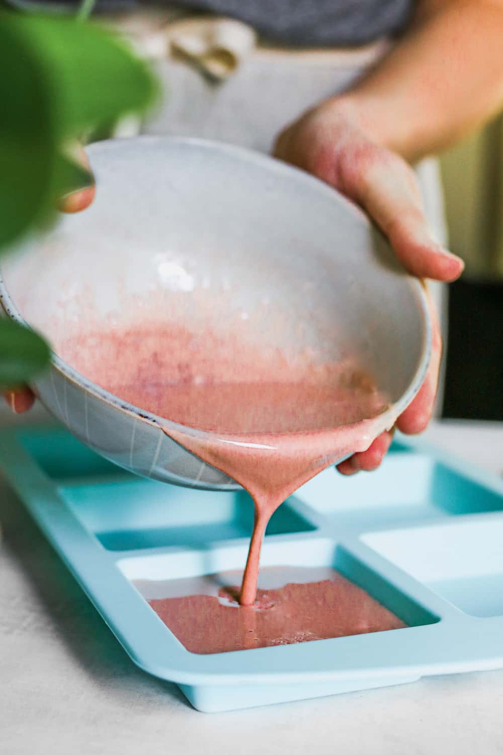 Pour pink clay soap into soap molds