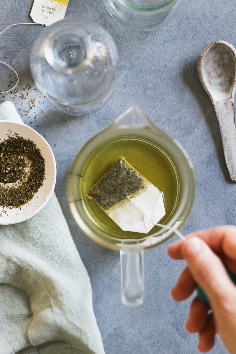 Using Green Tea to Fight Puffiness - cool used tea bags placed on the eyes