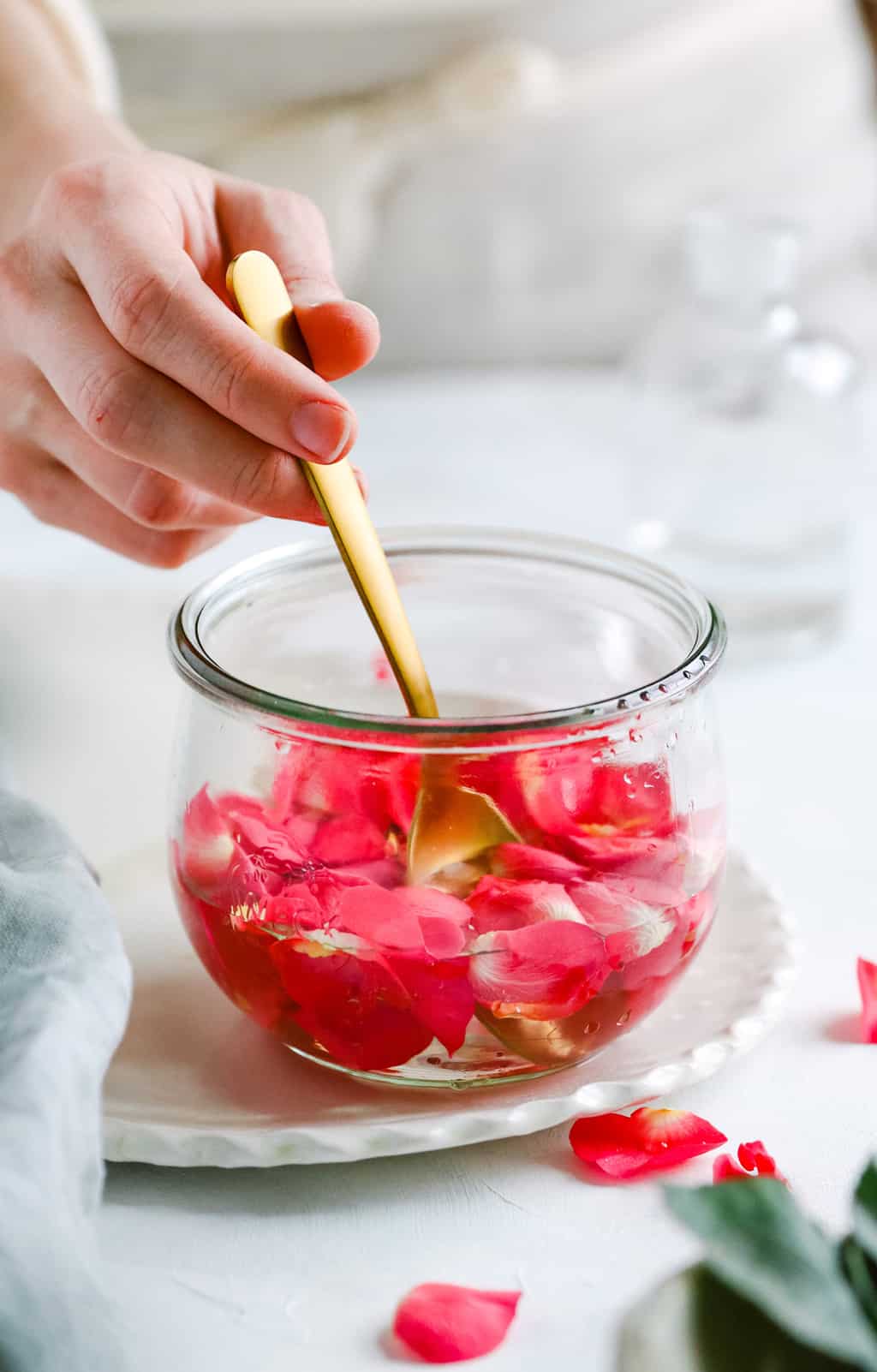 Soaking rose petals in vodka