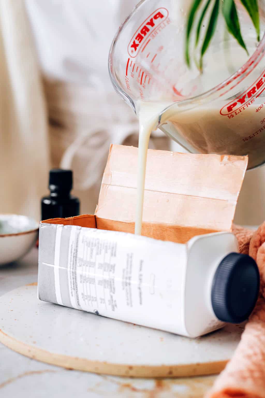 Pour soap into cardboard mold container