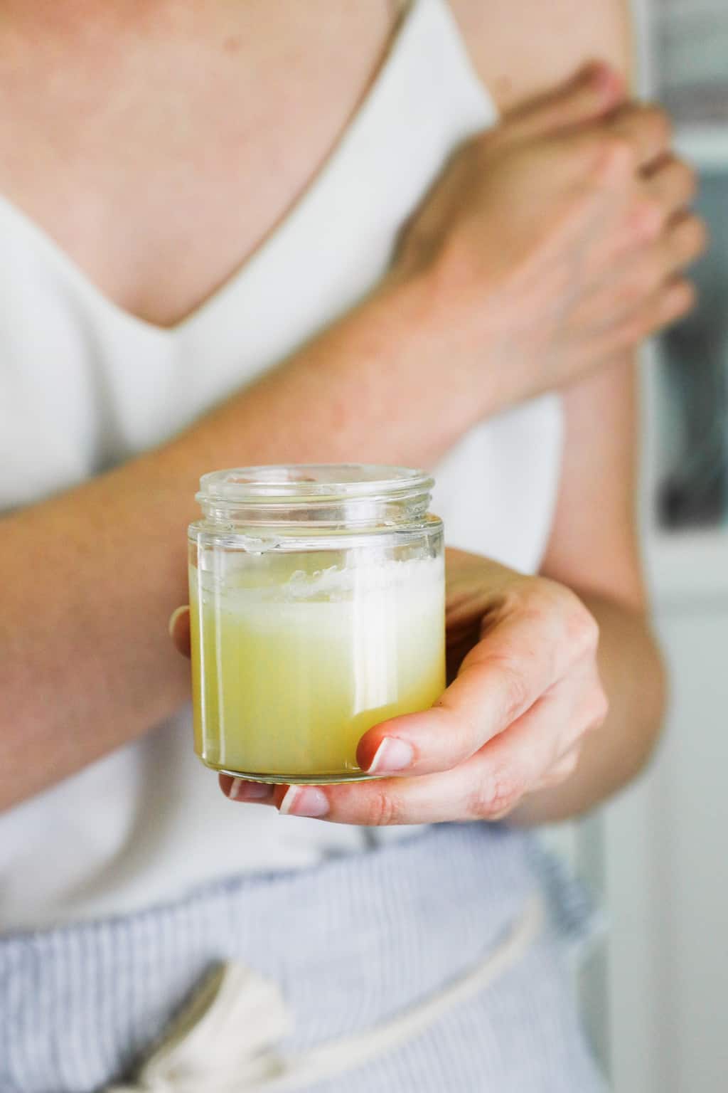 This DIY warming muscle rub is made with a blend of essential oils that soothes post-workout soreness and other aches and pains.