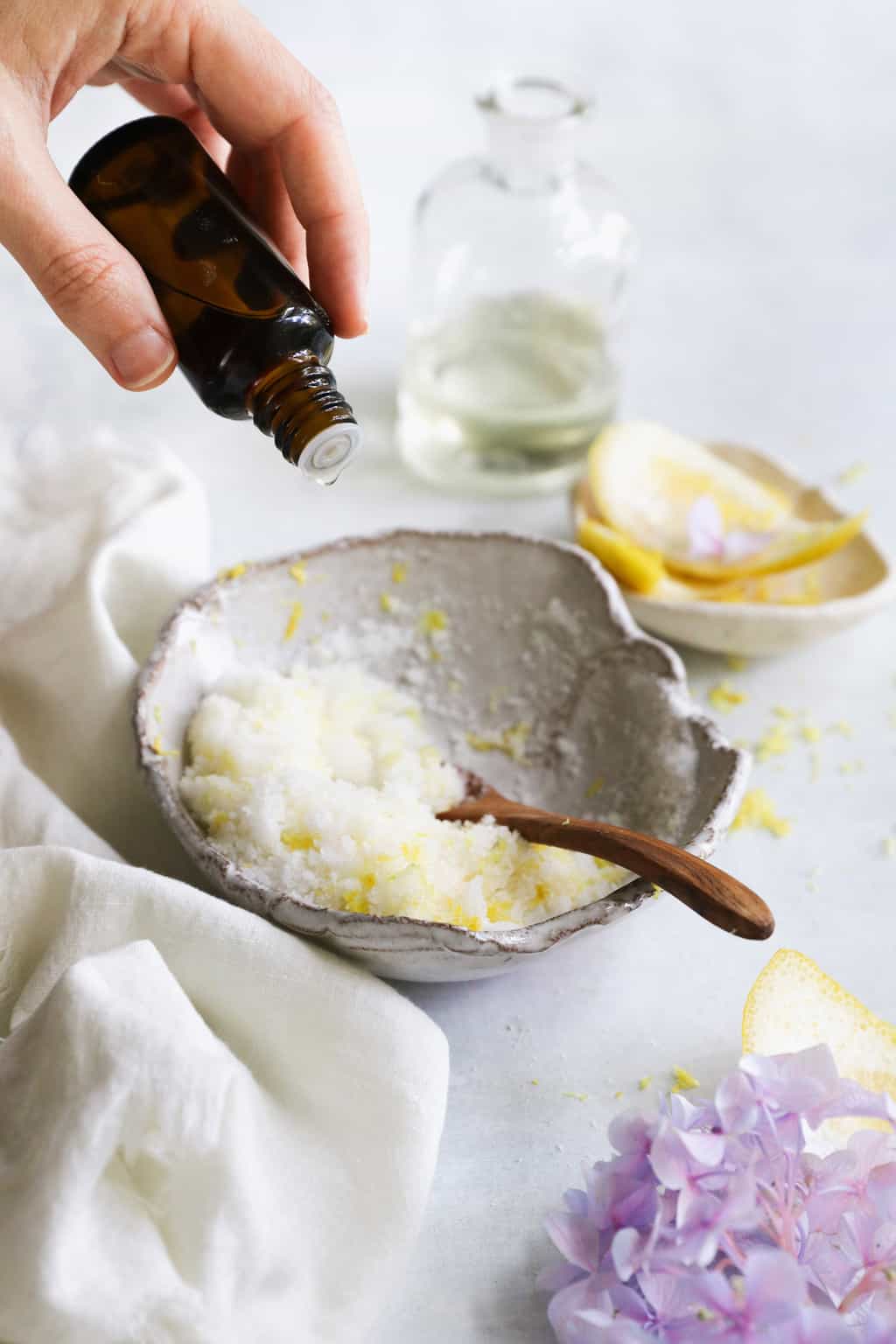 Adding optional extras like essential oils and lemon zest to a homemade Sugar scrub