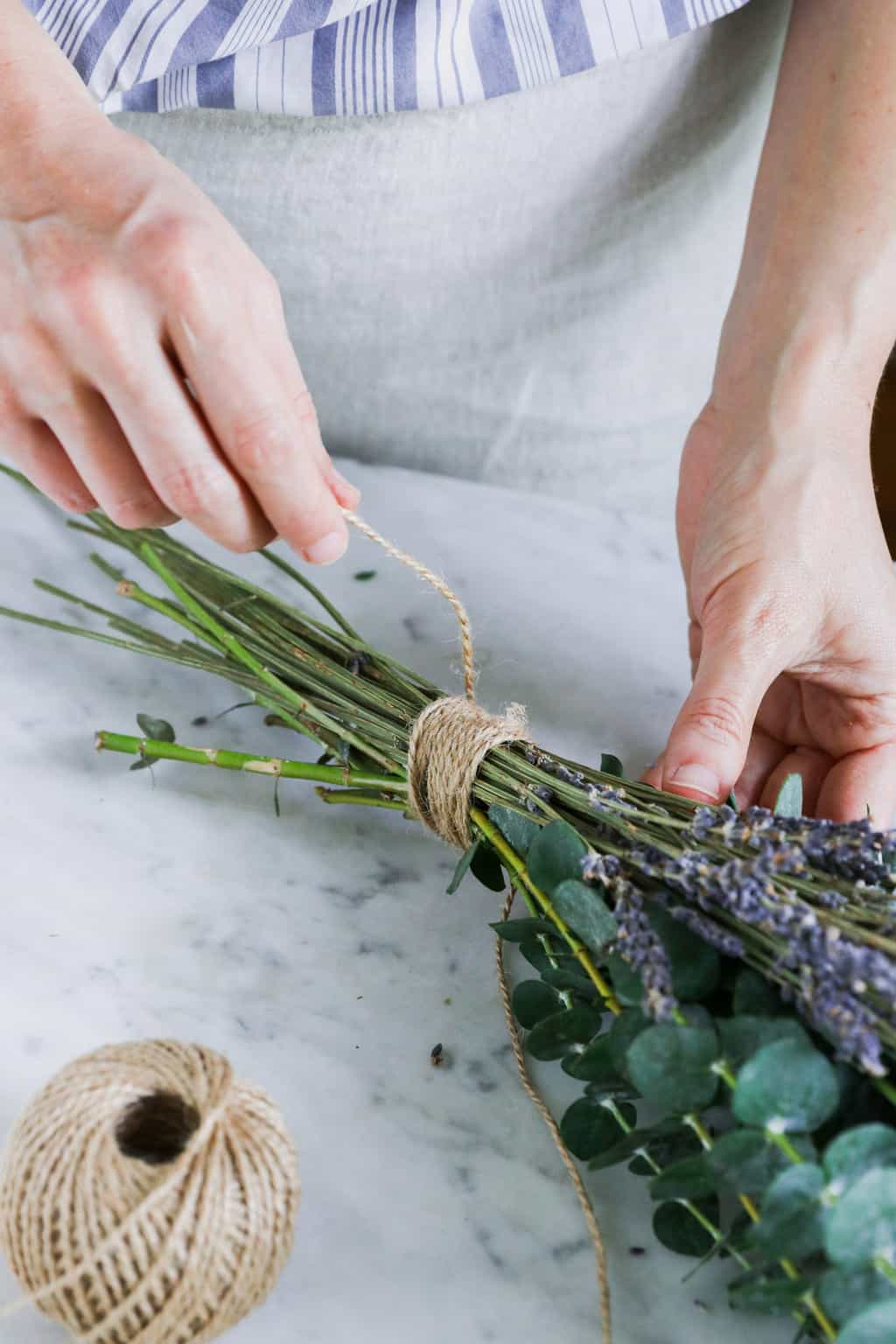 Wrap branches of eucalyptus and lavender with twine