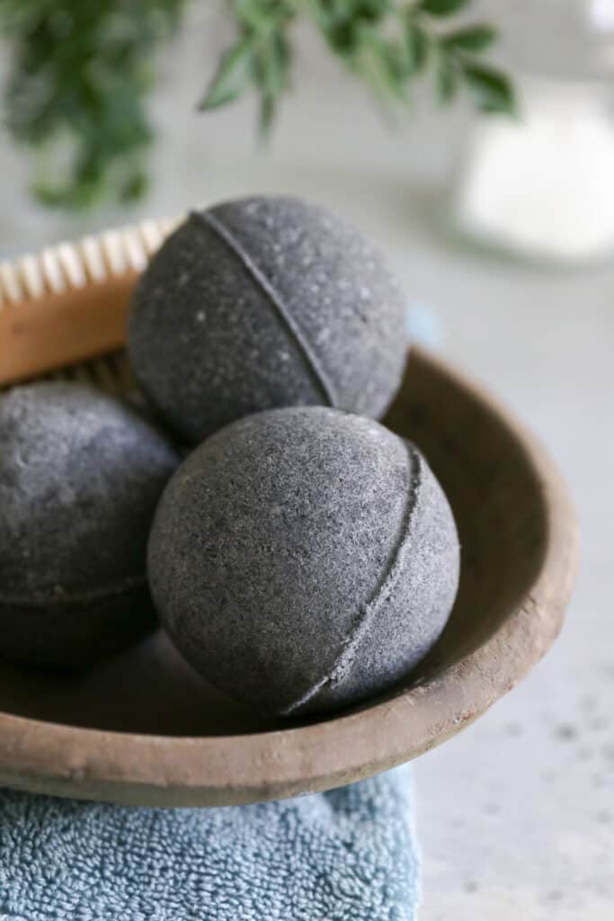 With soothing essential oil and activated charcoal, these black bath bombs are just what you need to calm irritated skin and get a relaxing soak too.