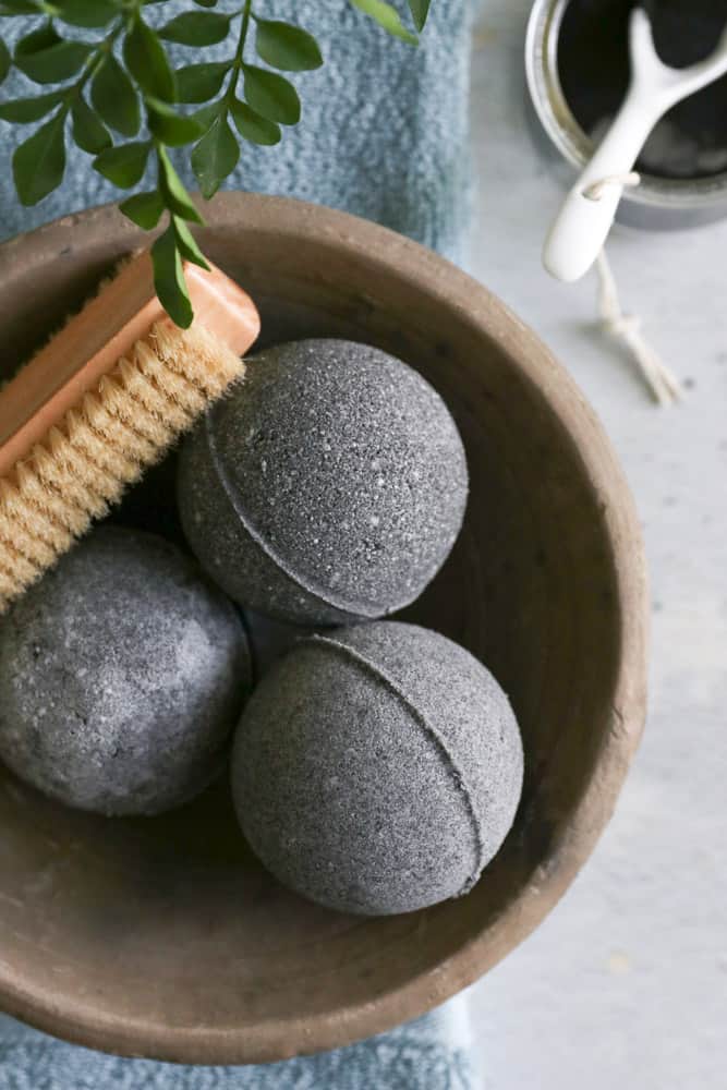With soothing essential oil and activated charcoal, these black bath bombs are just what you need to calm irritated skin and get a relaxing soak too.
