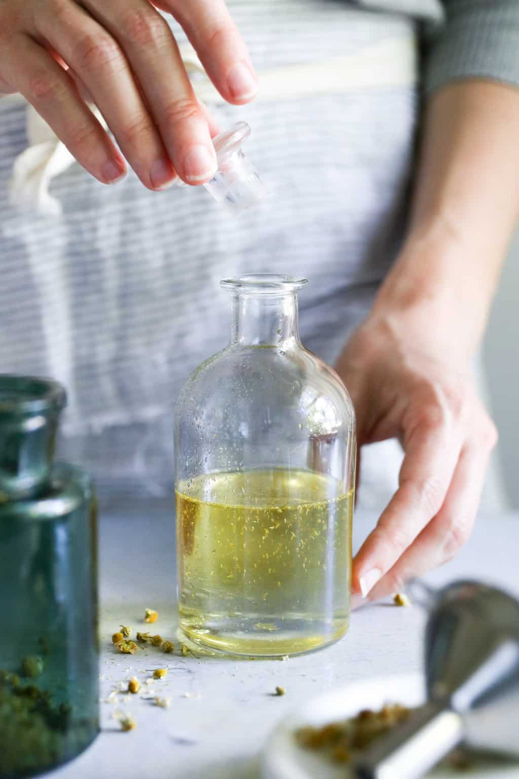 Unwind With This DIY Calming Chamomile Bath Oil | Hello Glow