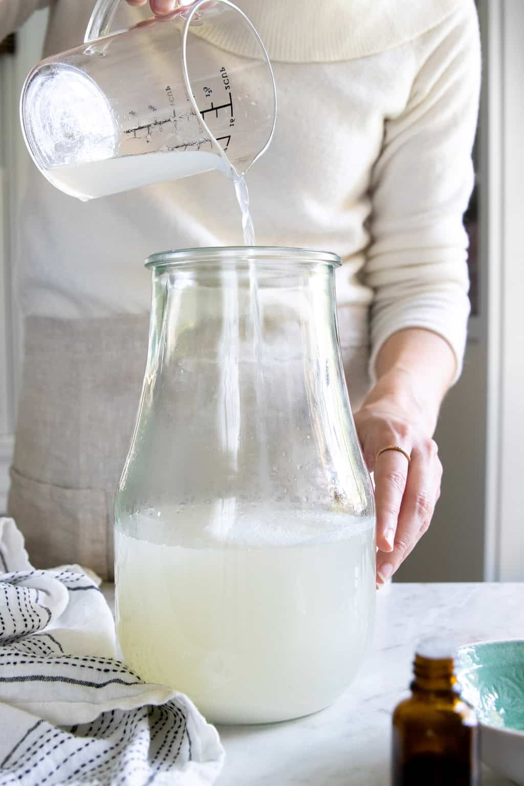 Combine soap and water in homemade liquid laundry detergent