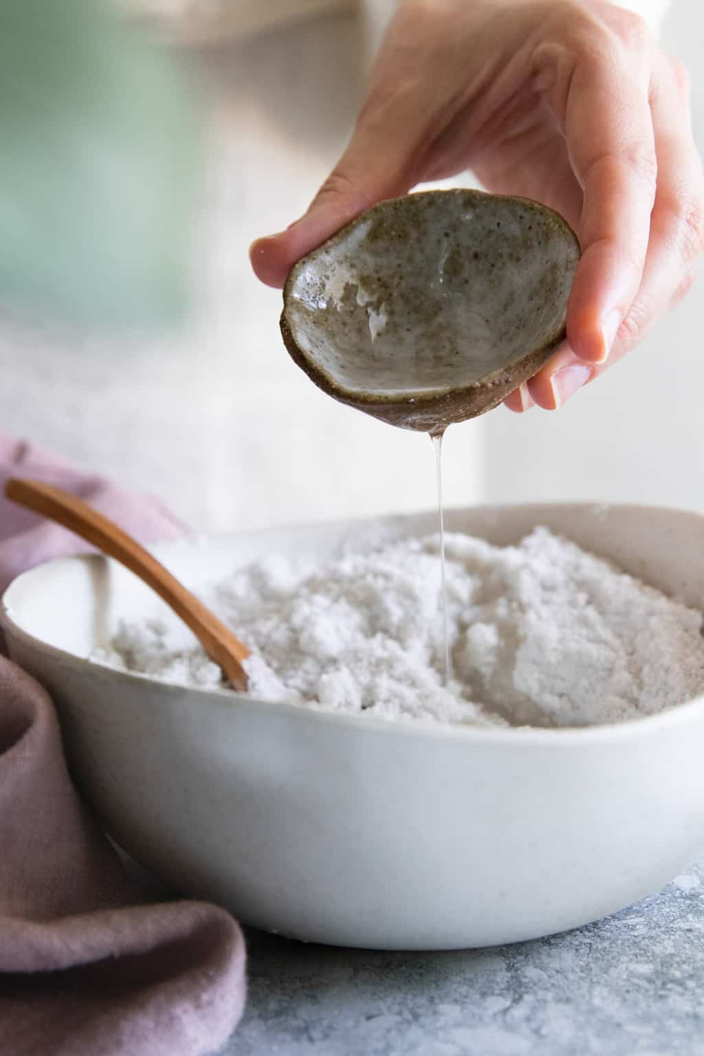 Combine wet and dry ingredients for bath bomb recipes