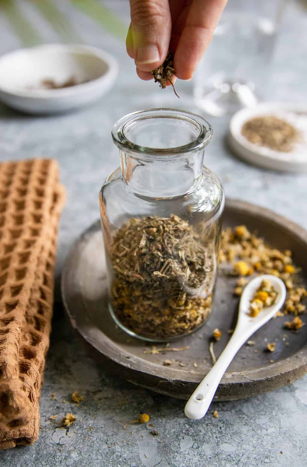 Add herbs to jar to make a tincture