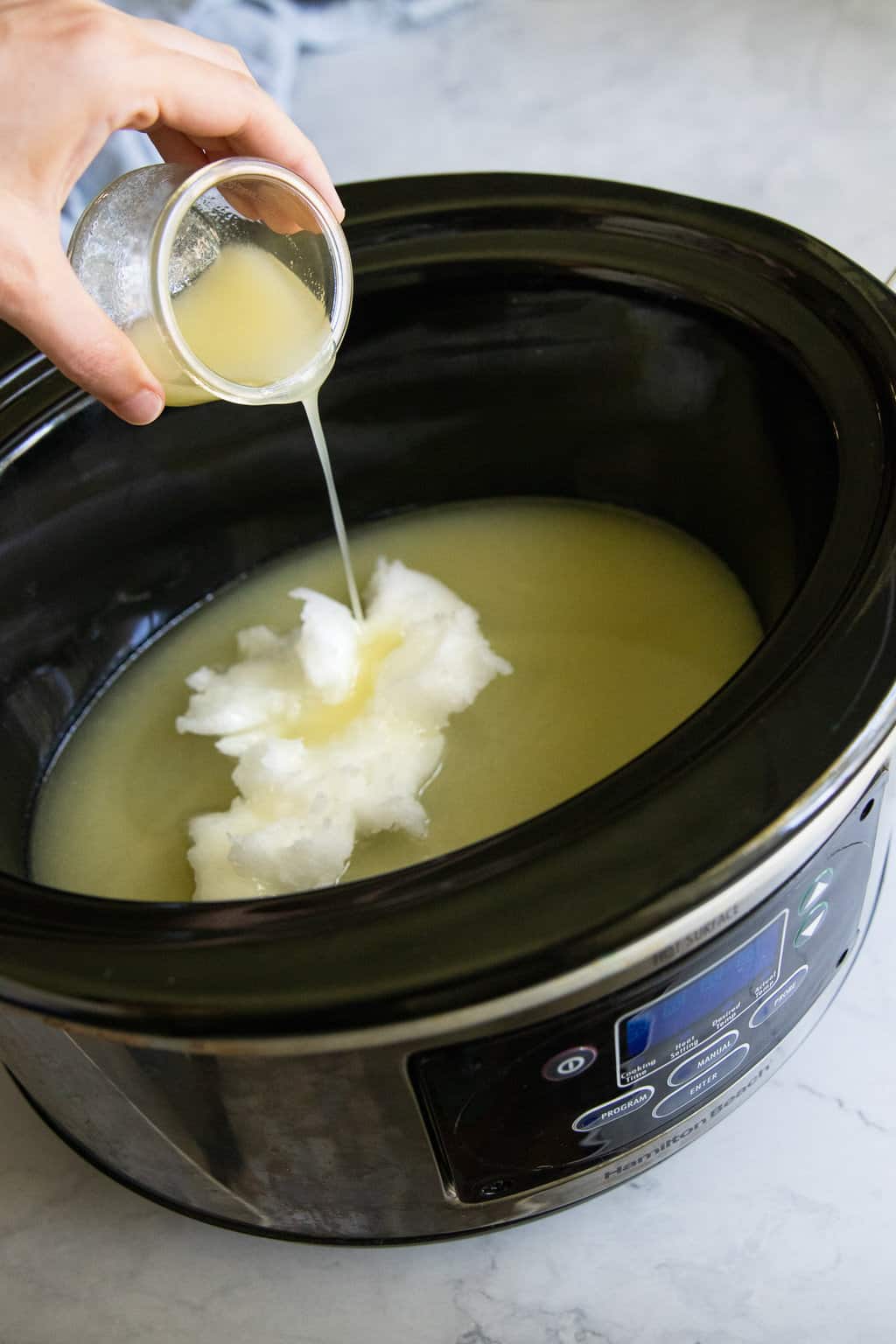 Combine oils in slow cooker for glycerin soap recipe