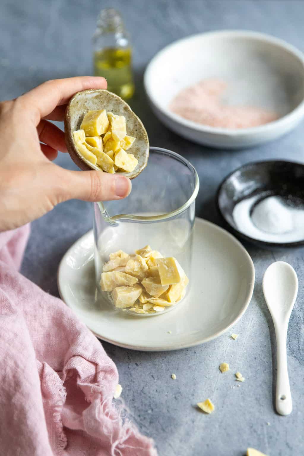 Melt cocoa butter for homemade shampoo bars