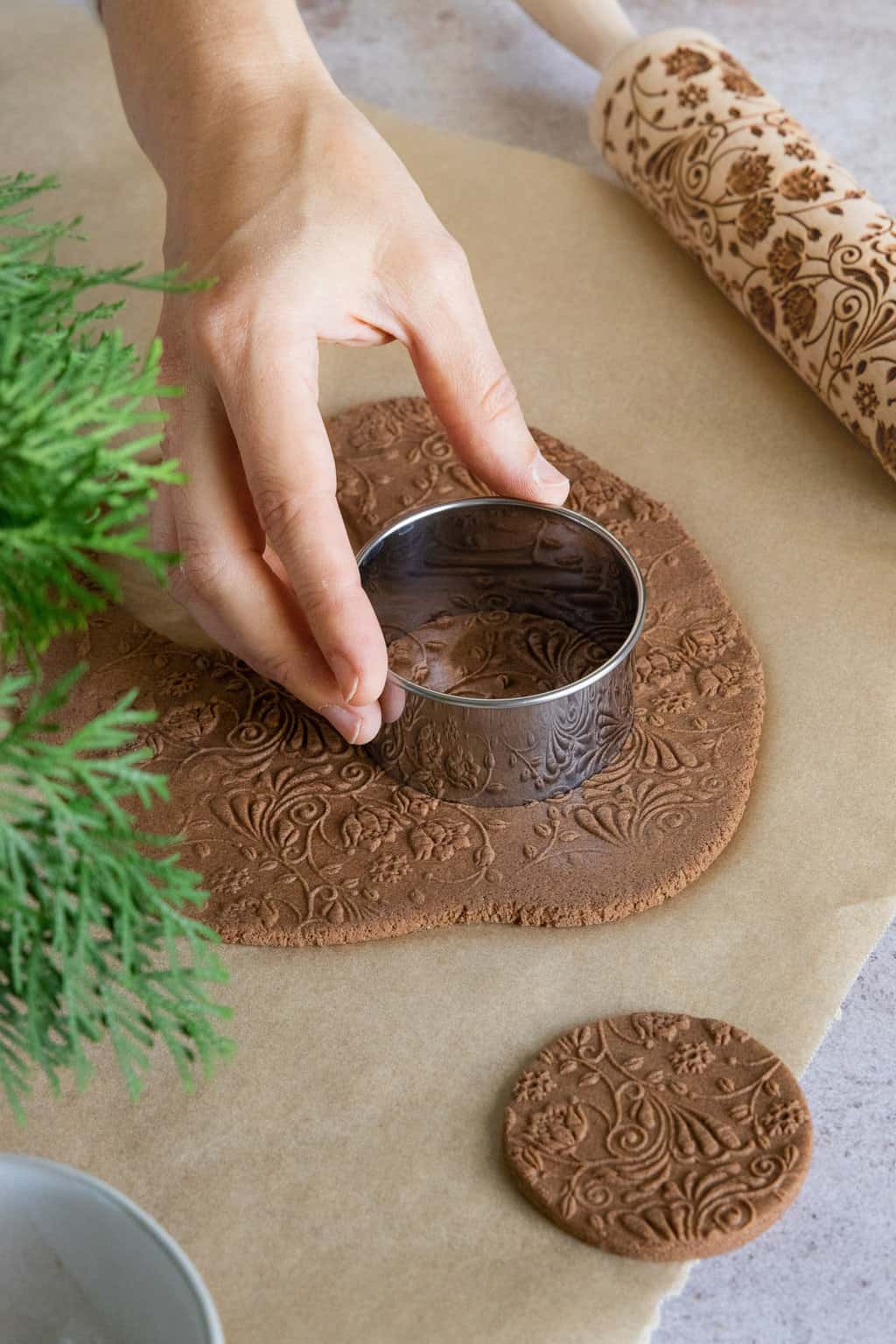 Cutting dough to make cinnamon ornaments