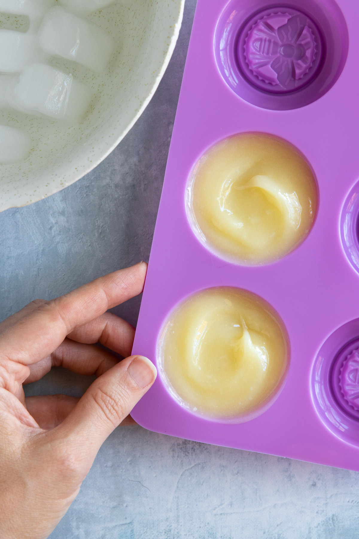 Letting oils and butters cool to harden for solid serum