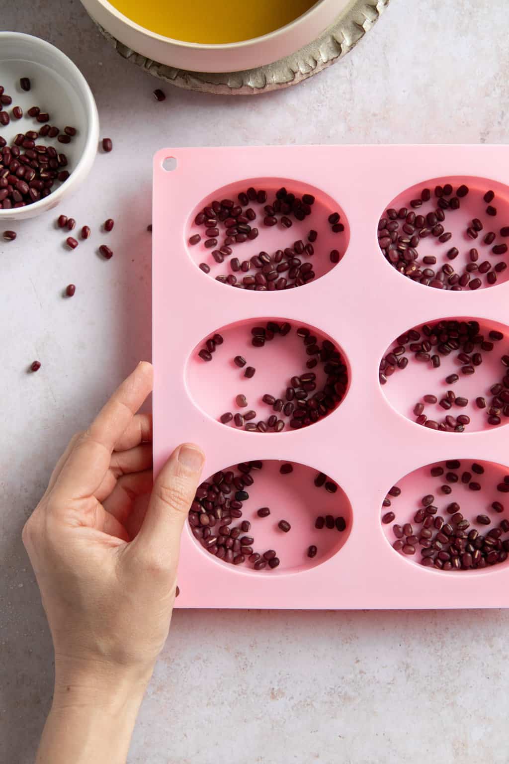 Place the beans in the mold for Lush copycat massage bars