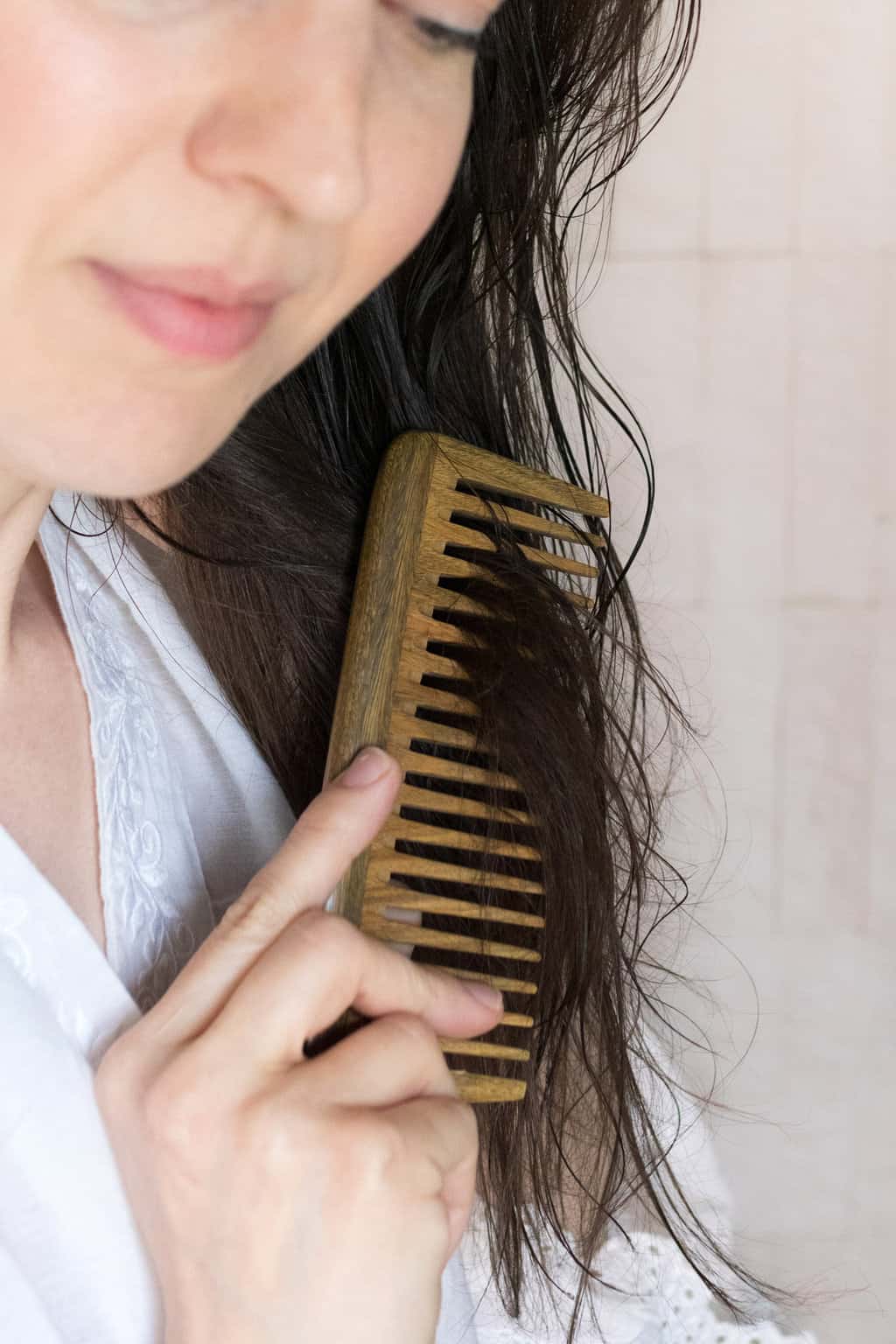 Comb hot oil treatment through the ends of your hair