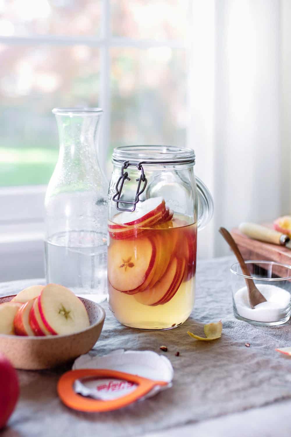 Let apples ferment for 4-6 weeks to make homemade apple cider vinegar