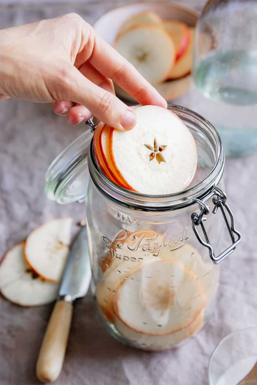 how to make apple cider vinegar - put roughly cut apples in a jar