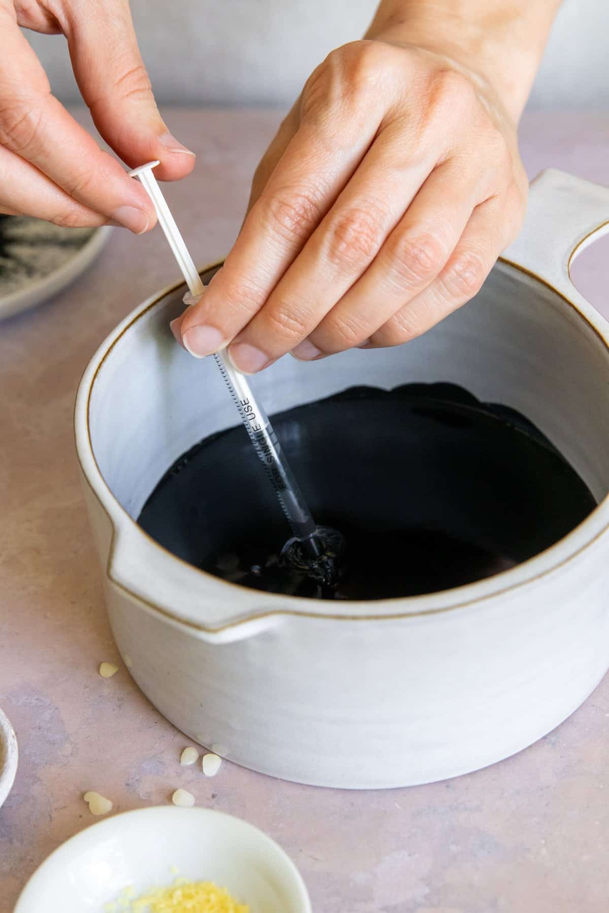 Draw wax into syringe