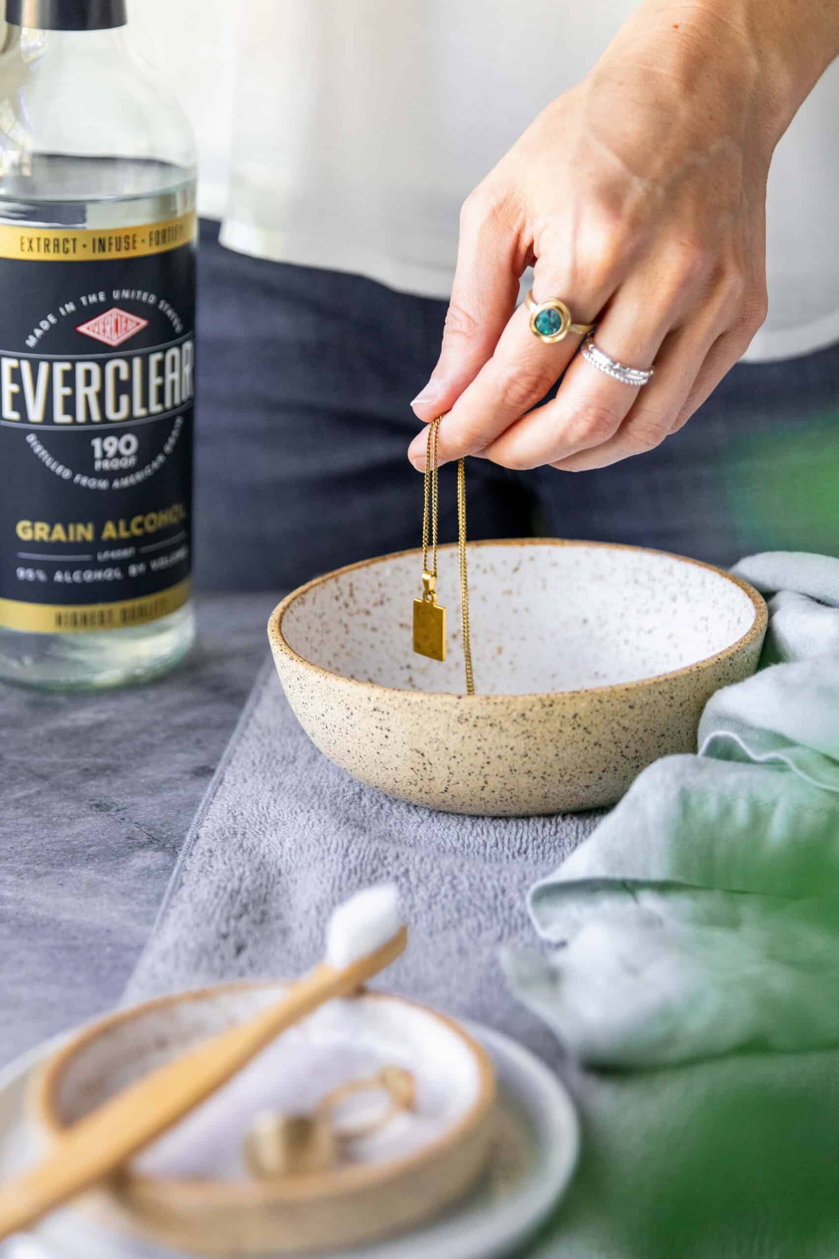 Add jewelry to small bowl before soaking to clean