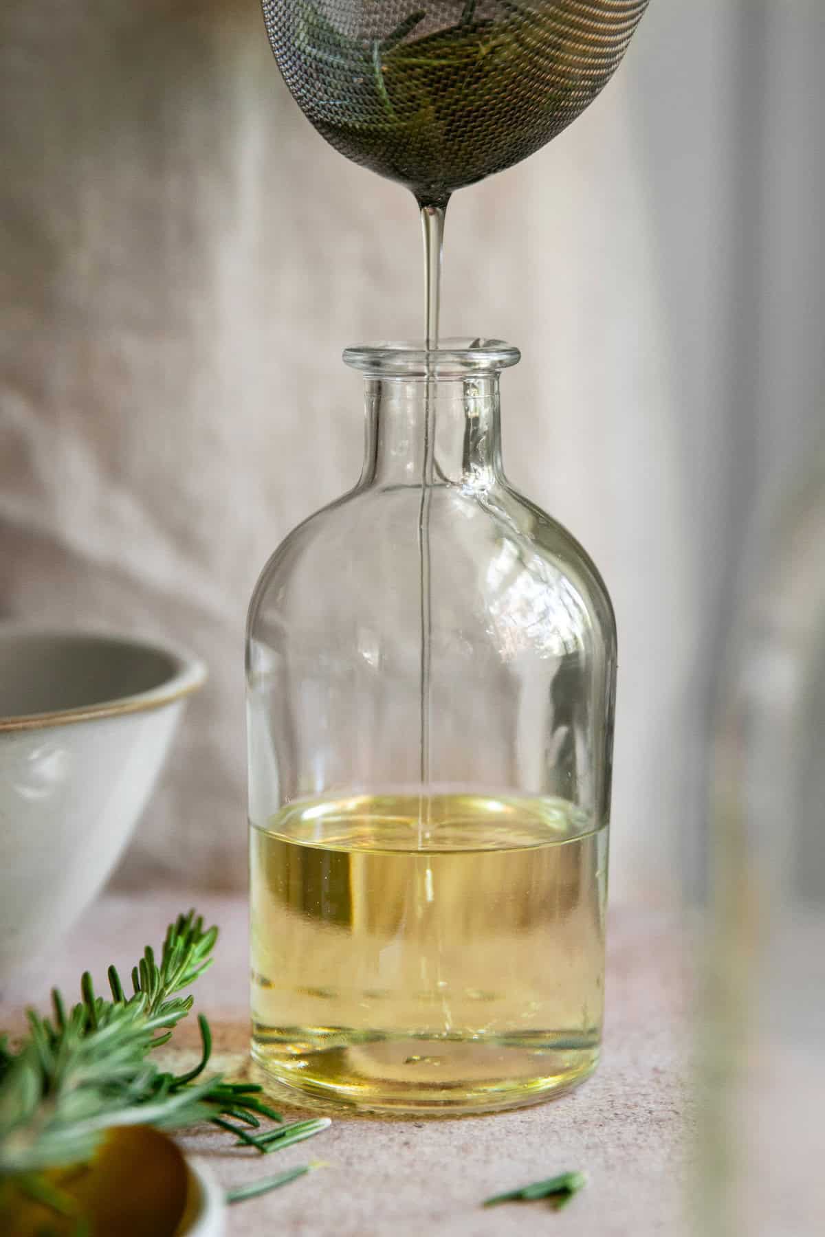 Strain out rosemary after infusing for 2 weeks