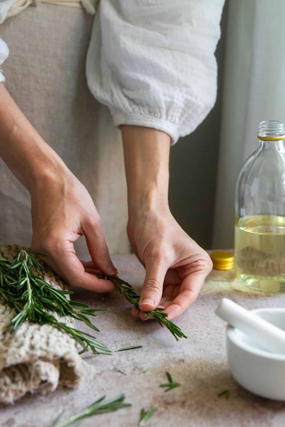 Crush rosemary before infusing into rosemary oil for hair