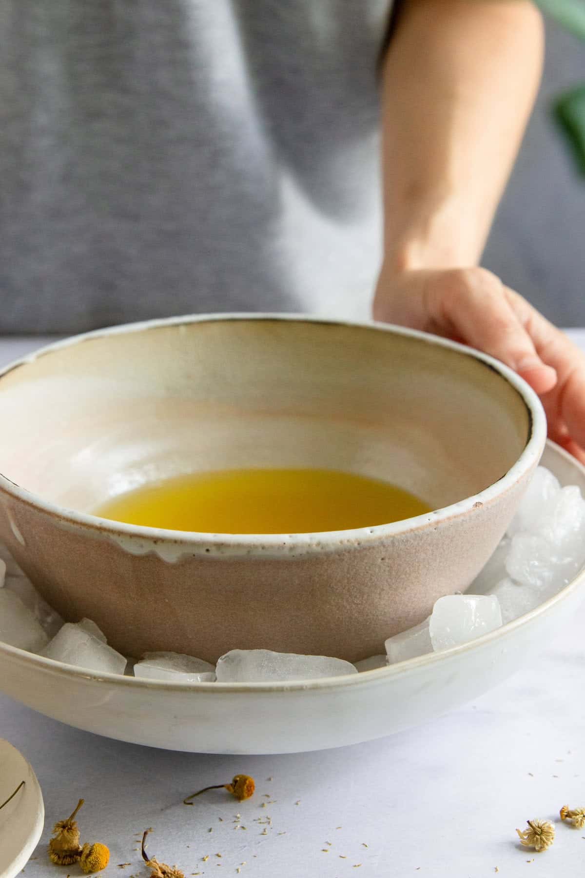 Put melted tallow balm oils in an ice bath