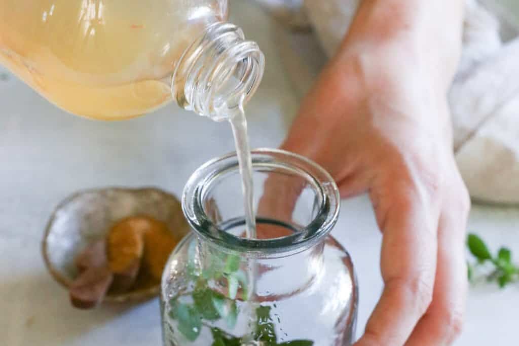 Add vinegar to infuse with herbs